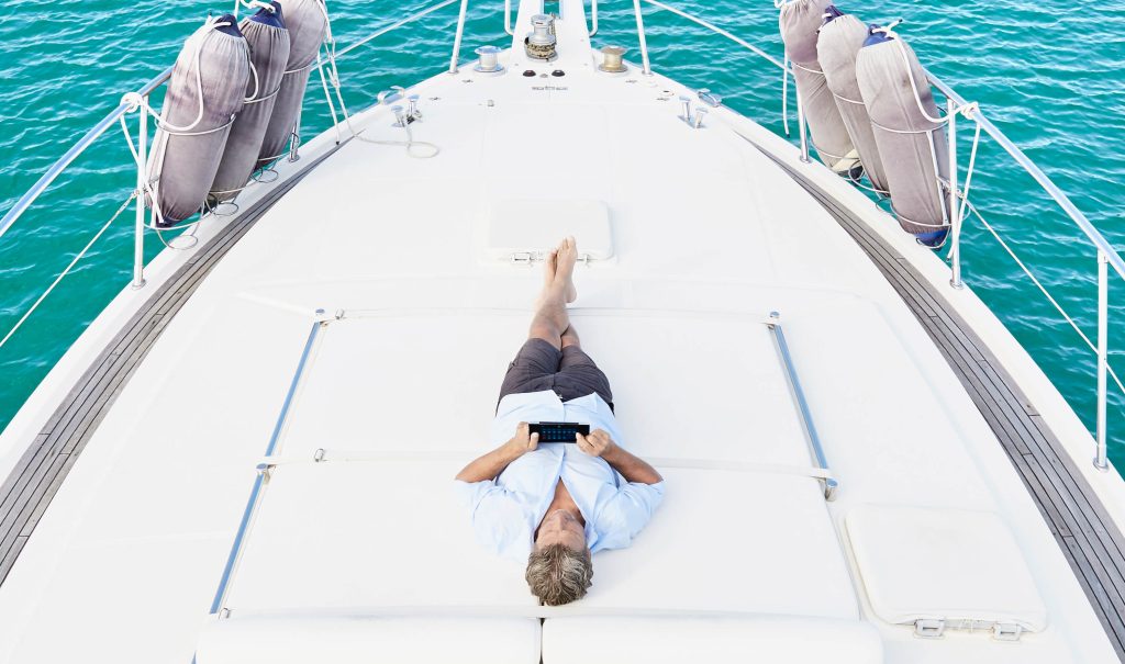 Man activating a smart boat with a mobile app.